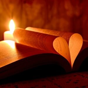 lighted candle on brown wooden table