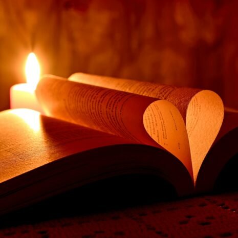 lighted candle on brown wooden table